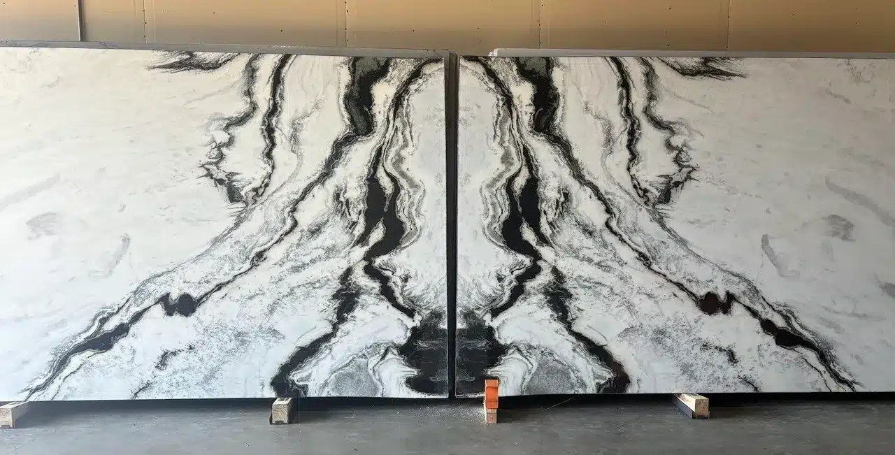 Large format natural stone slab with high-contrast monochrome movement for architectural use.