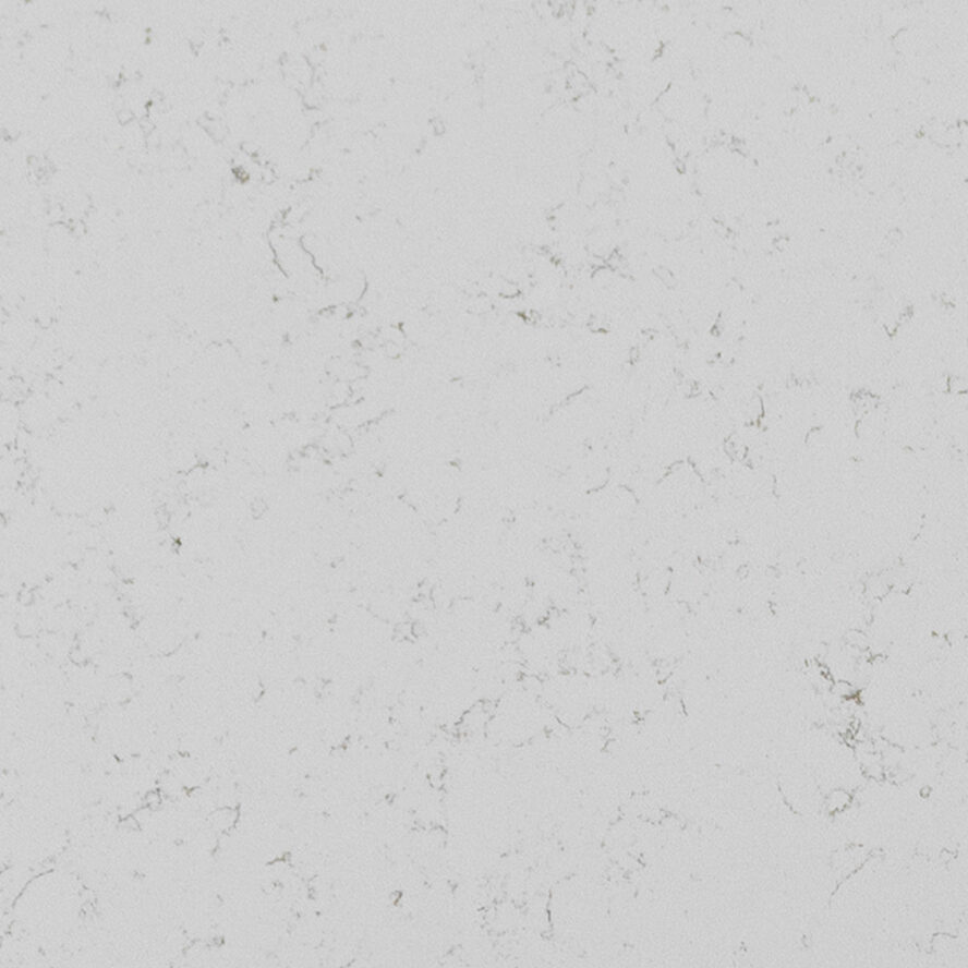 Macro view of quartz surface revealing subtle texture, natural-looking veining, and warm gold accents against a crisp white background.