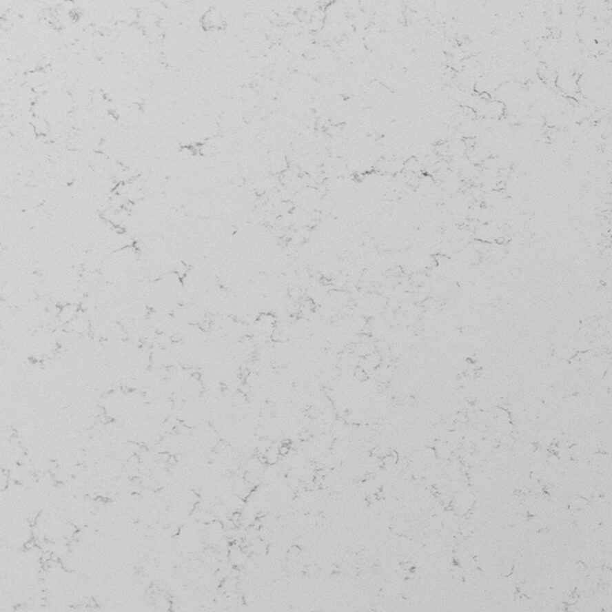 Close-up detail of Carrara Gold Quartz highlighting intricate gray veining blended with soft golden hues on a bright white base.