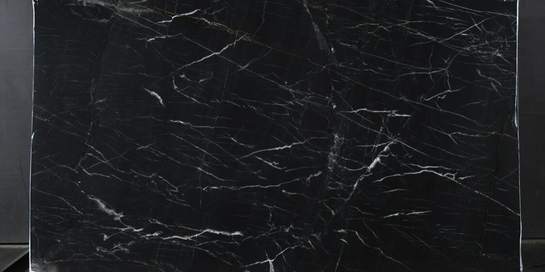 A full view of a Venom Quartzite slab showcasing its dramatic midnight black canvas and high-contrast veining.