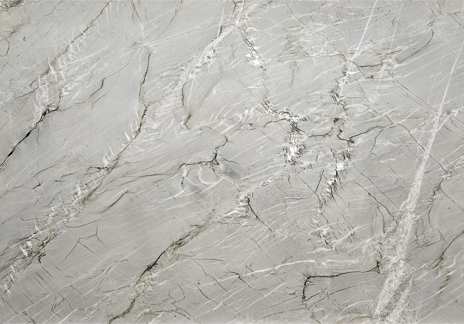 Bianco Superiore quartzite slab featuring a creamy white and off-white base with subtle grey and beige veining for luxury interior design.
