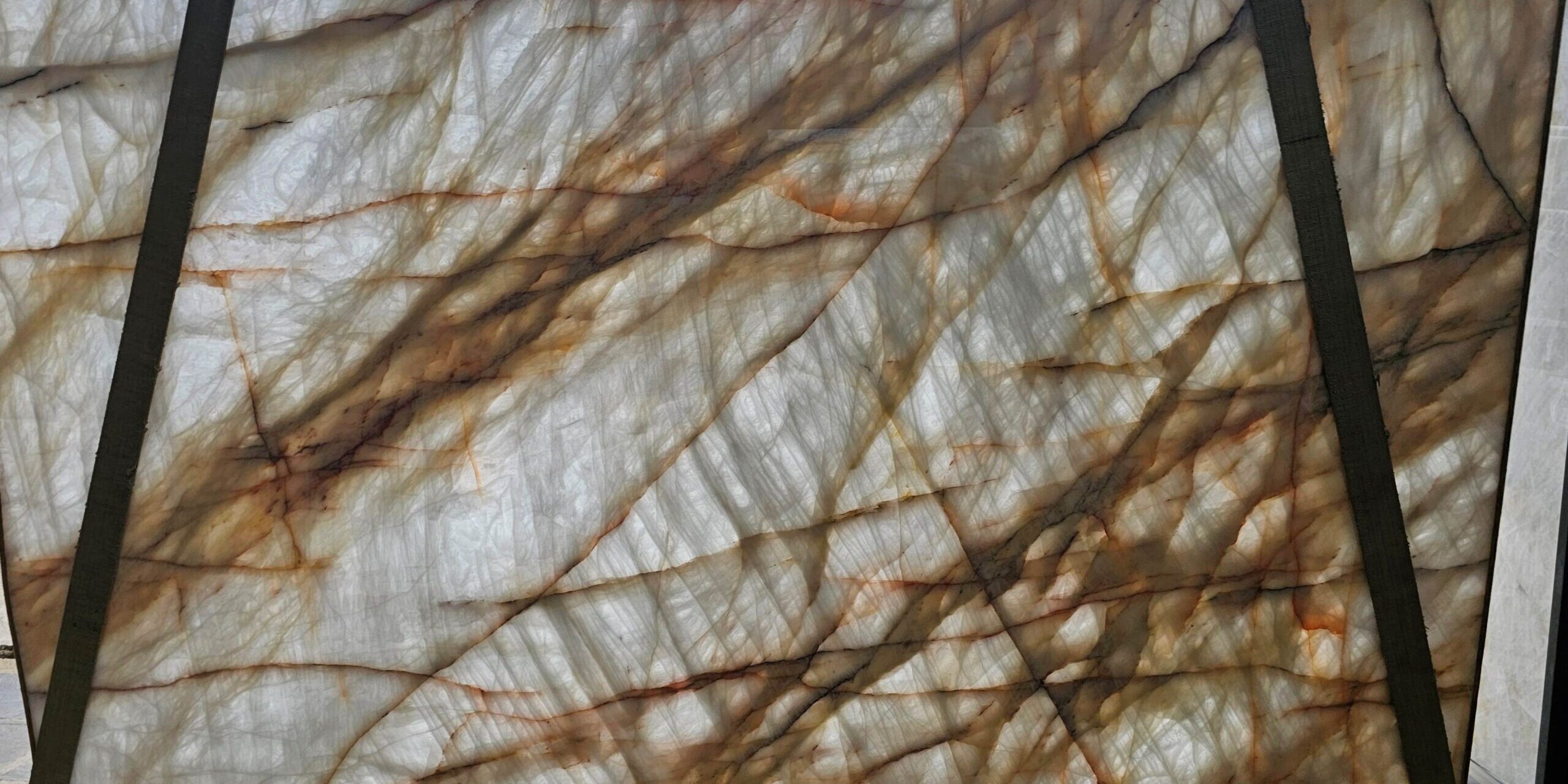 A polished cristallo slab displayed in a professional gallery setting.