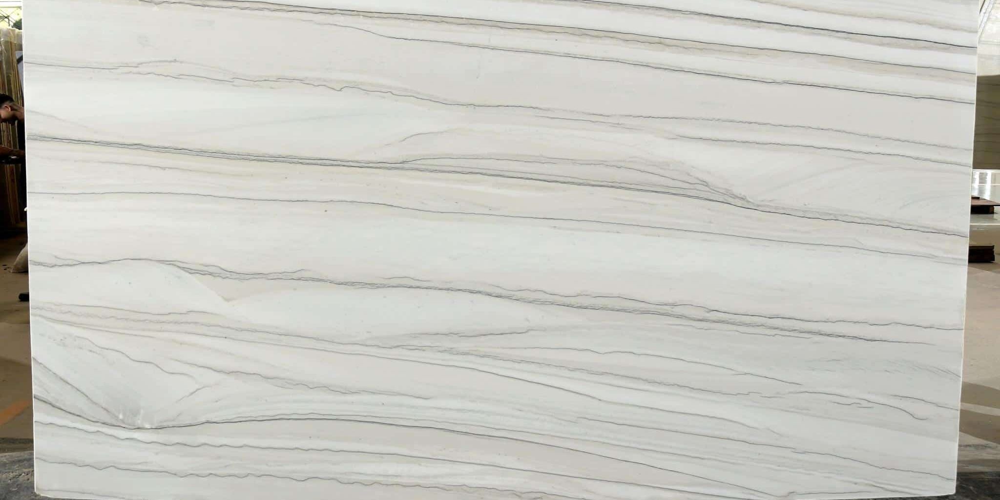 Large format natural stone slab with parallel grey veins, ideal for modern architectural projects.