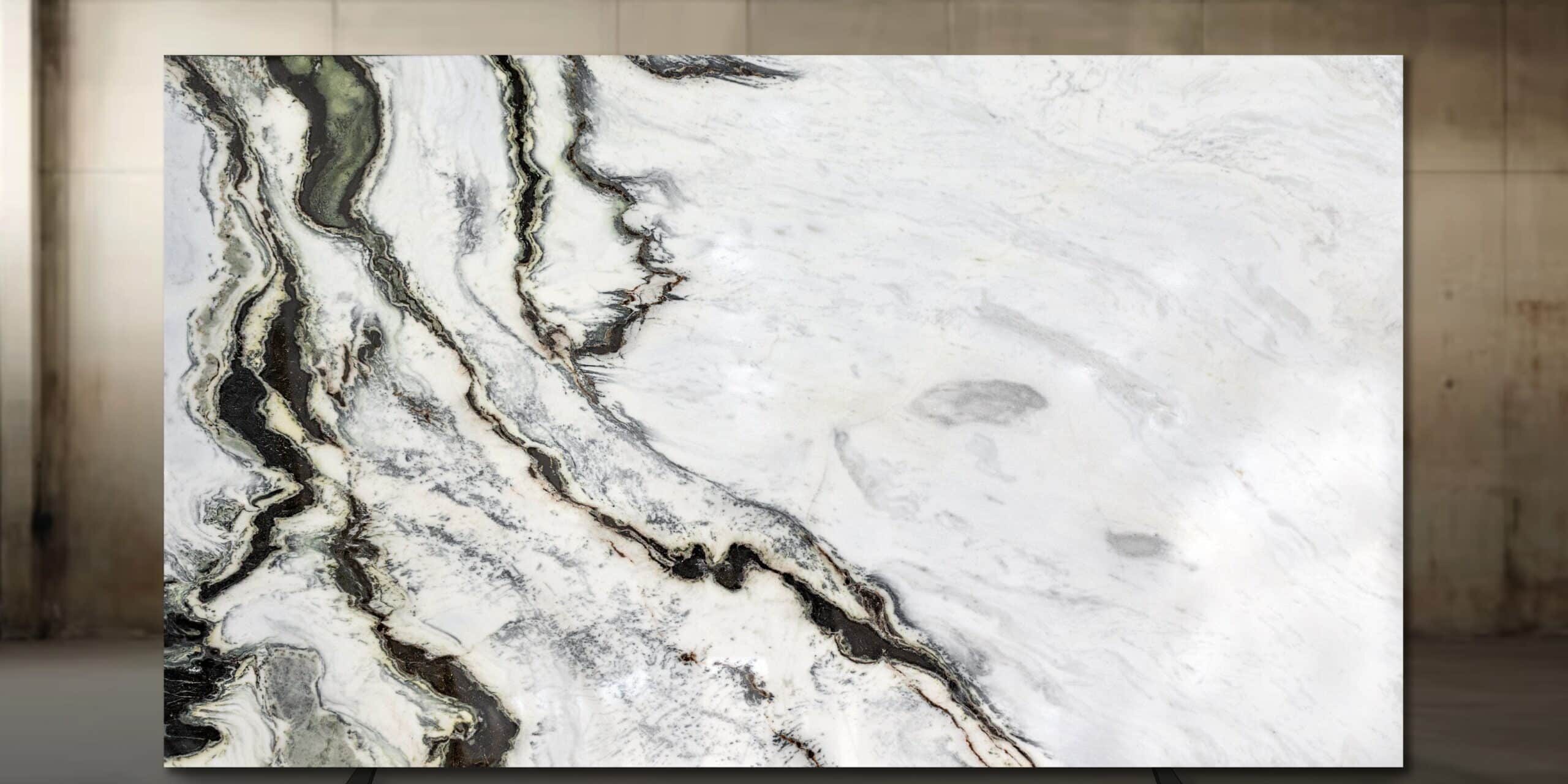 Premium Calacatta Brazil quartzite displaying dramatic sweeping veins on a white background.