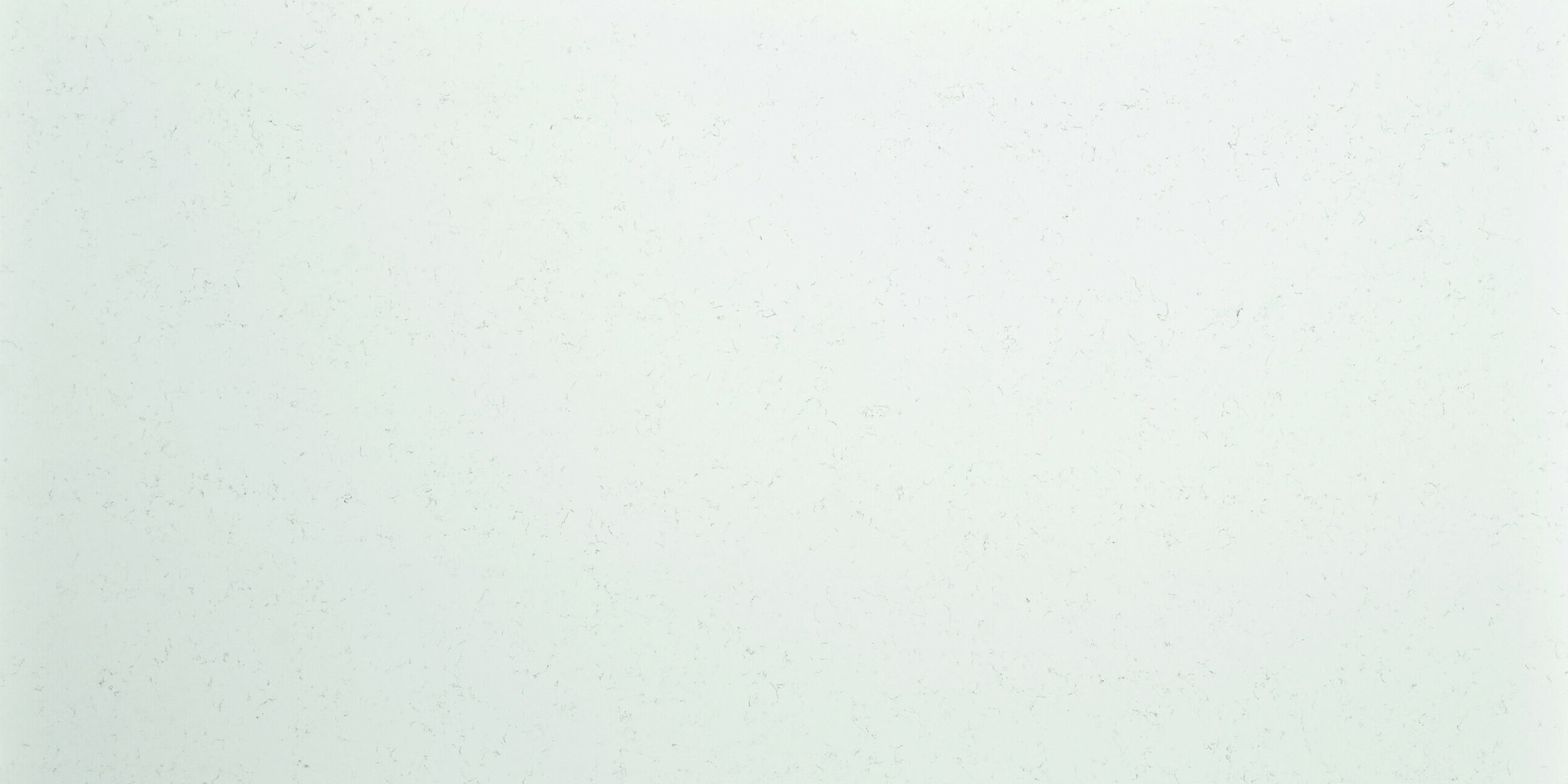 Polished slab of Carrara Gold Quartz showcasing refined marble-inspired veining with a clean, elegant surface.