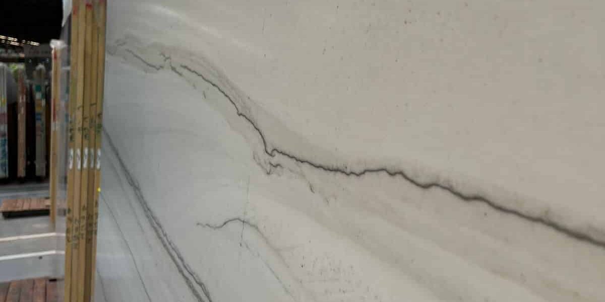 Close-up of a polished Chantilly quartzite surface showing fine charcoal lines on a white background.