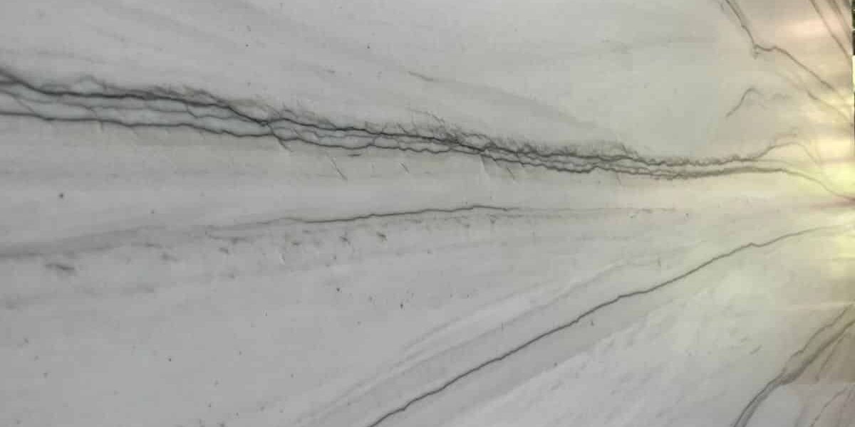 Detailed view of the horizontal grey veining and smooth texture of a high-quality natural stone.