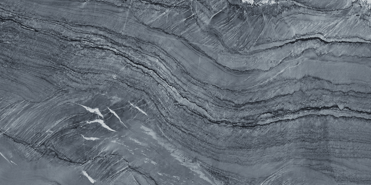 A detailed close-up shot showcasing the rich, matte texture of a leathered natural stone surface with contrasting charcoal and translucent mineral lines.