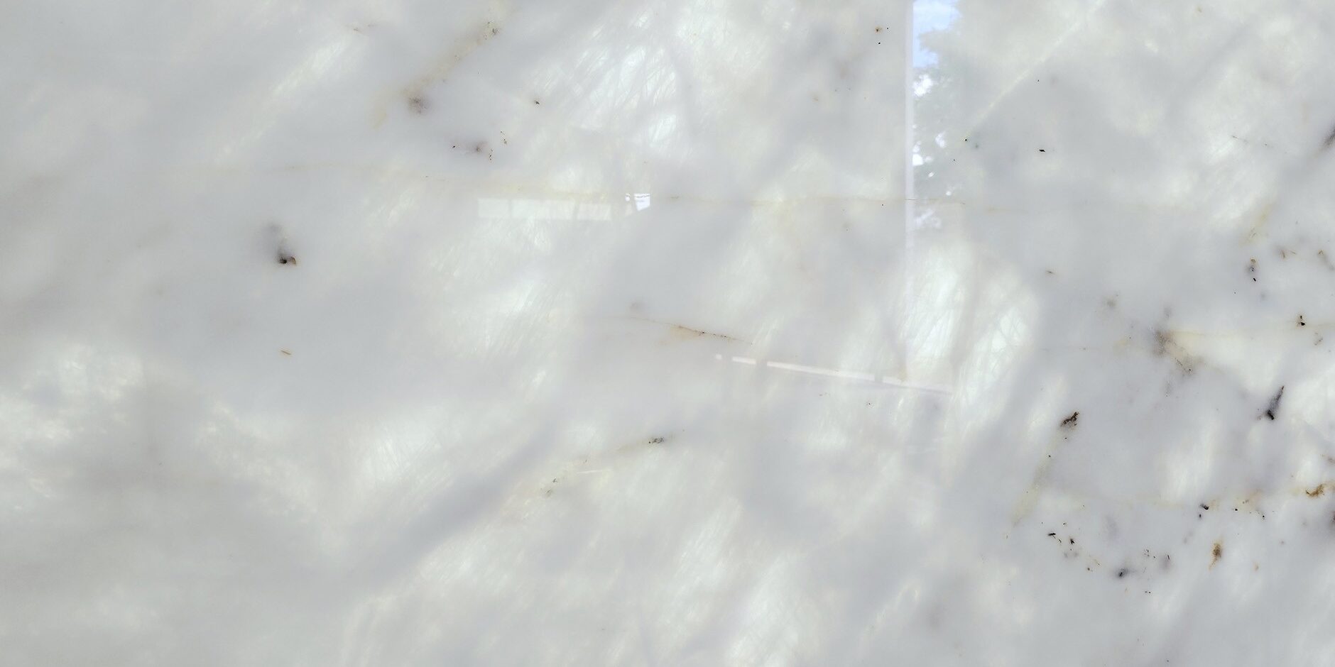 Macro shot of the shimmering white surface and translucent properties of natural stone.