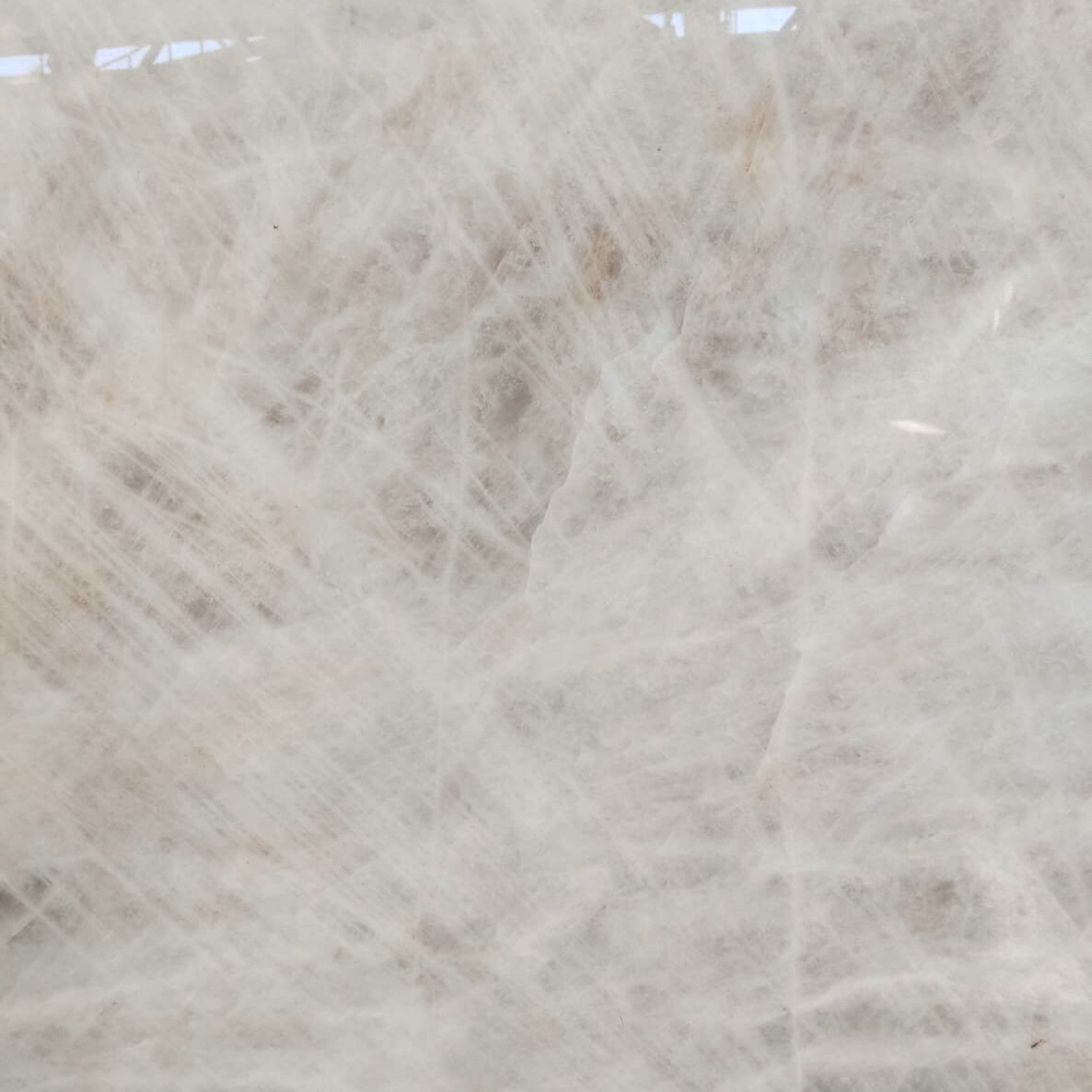 Extreme close-up of the crystalline texture and amber veining of a high-end natural stone.