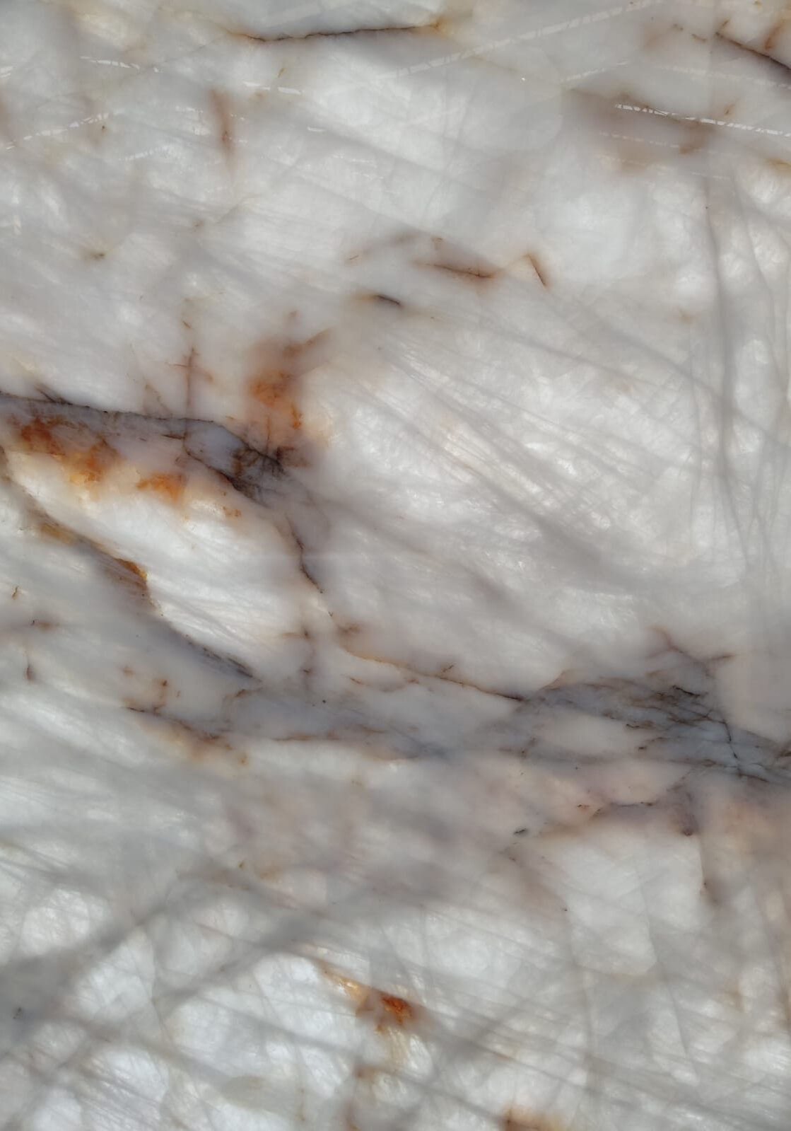 Macro view of the translucent quartz surface showing the depth and golden threading of the stone.