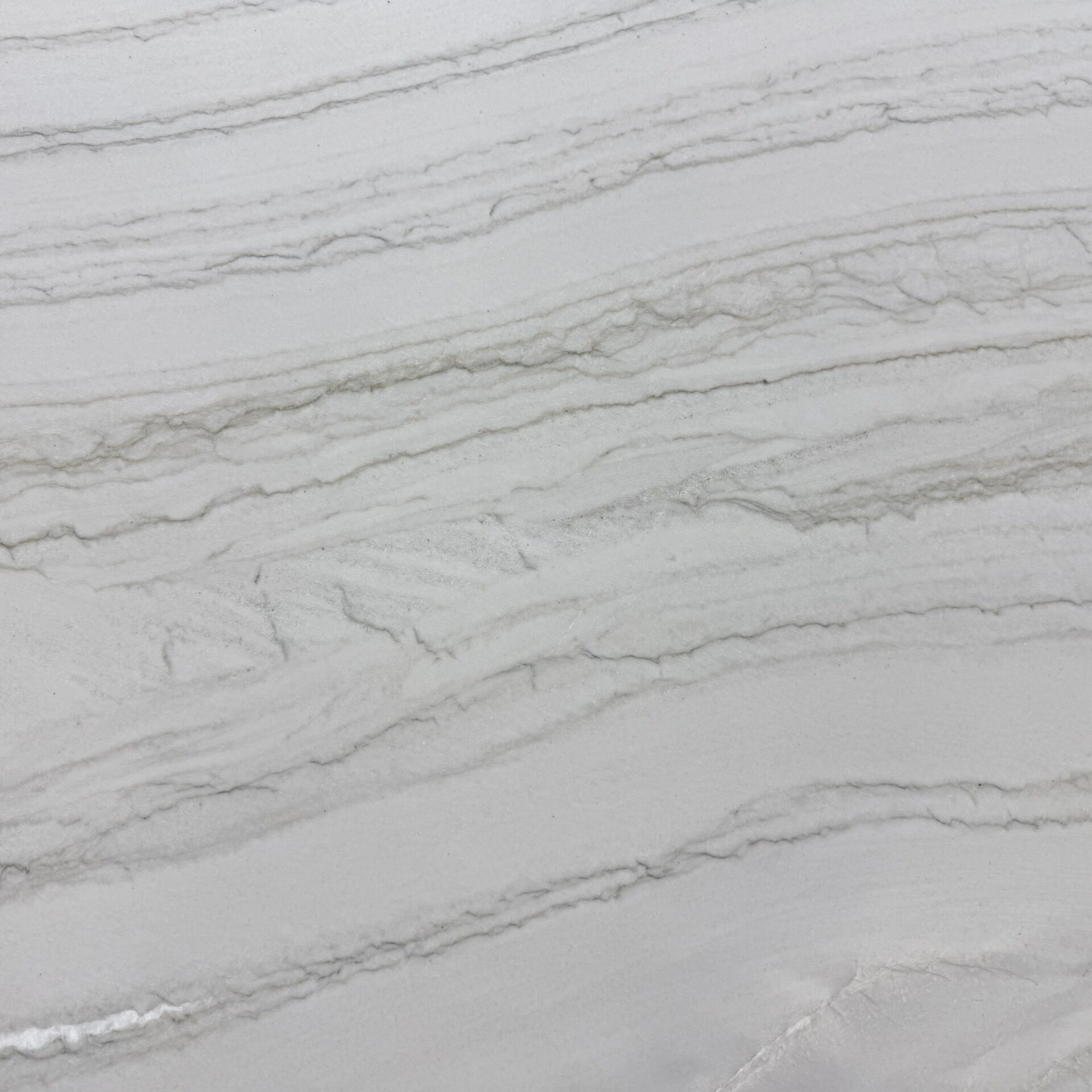 Extreme close-up of Diamond Lux quartzite showing unique crystal inclusions and gold accents.