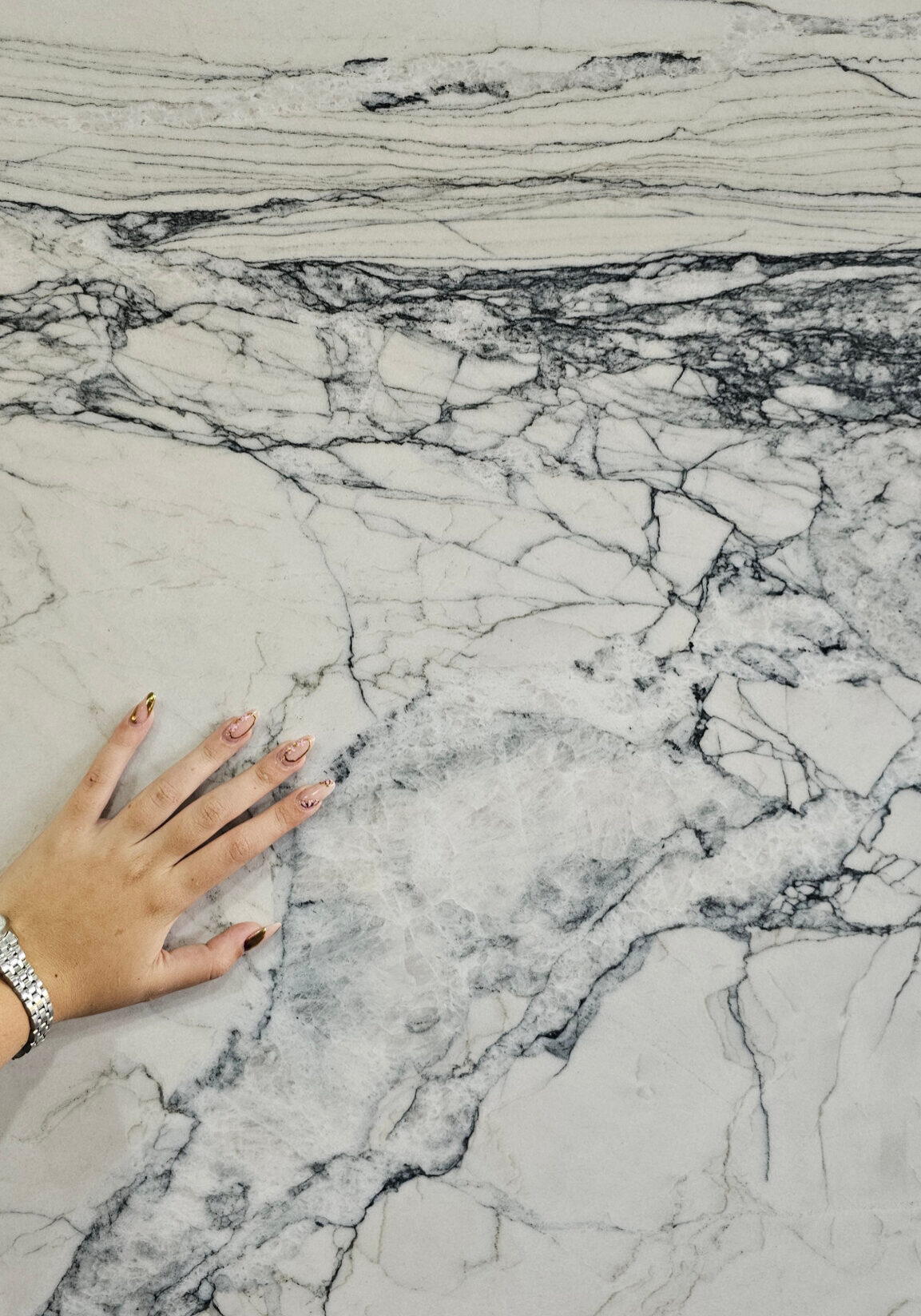 Fantasy Lux Quartzite close-up showcasing soft gray veining with warm beige and white natural patterns.