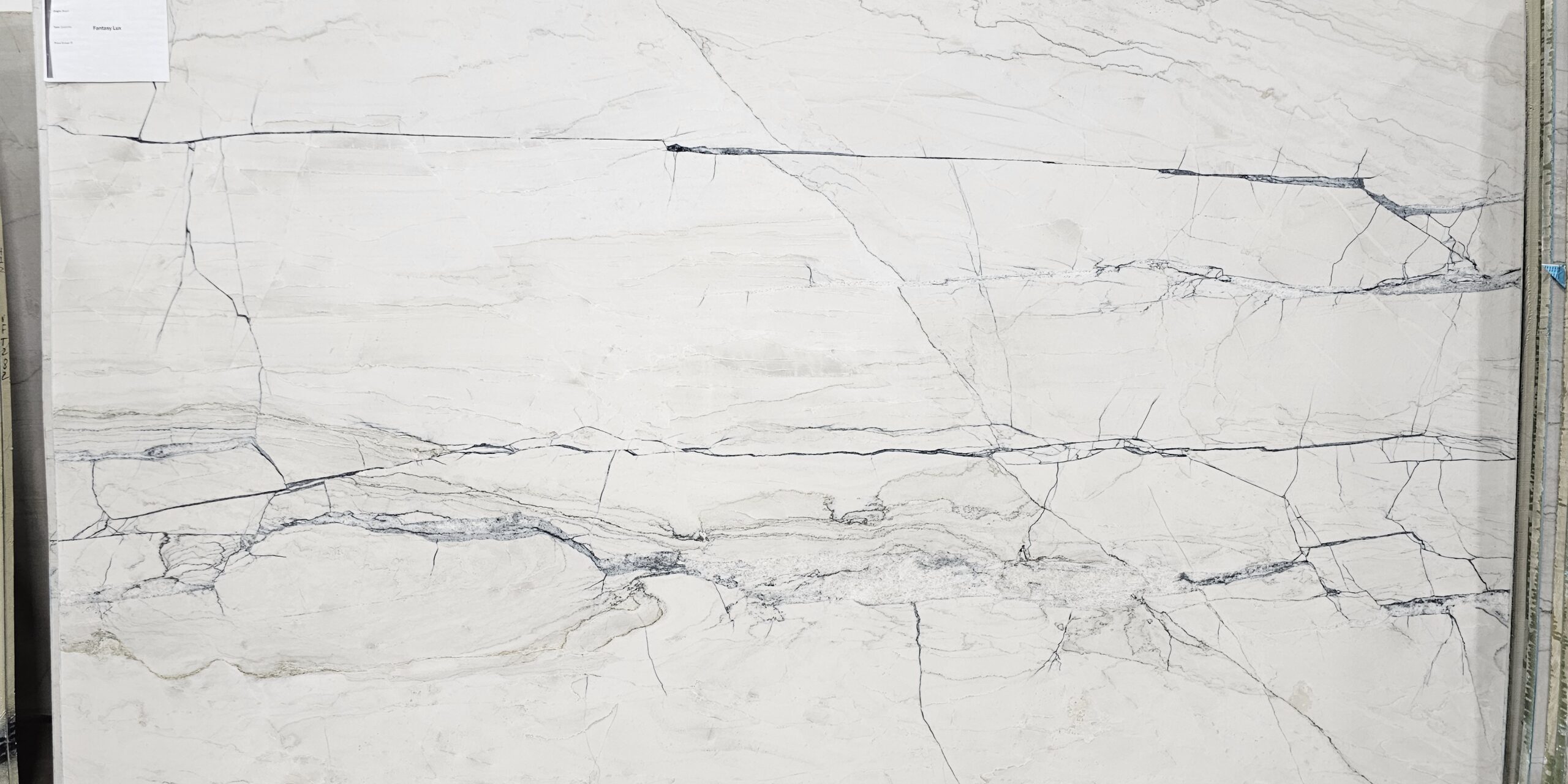 Premium white stone slab available at our quartzite store in Austin, perfect for luxury projects.