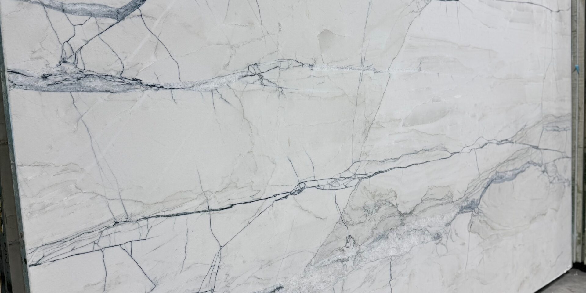 View of the consistent white tones and elegant movement in a hand-selected Fantasy Lux Quartzite.