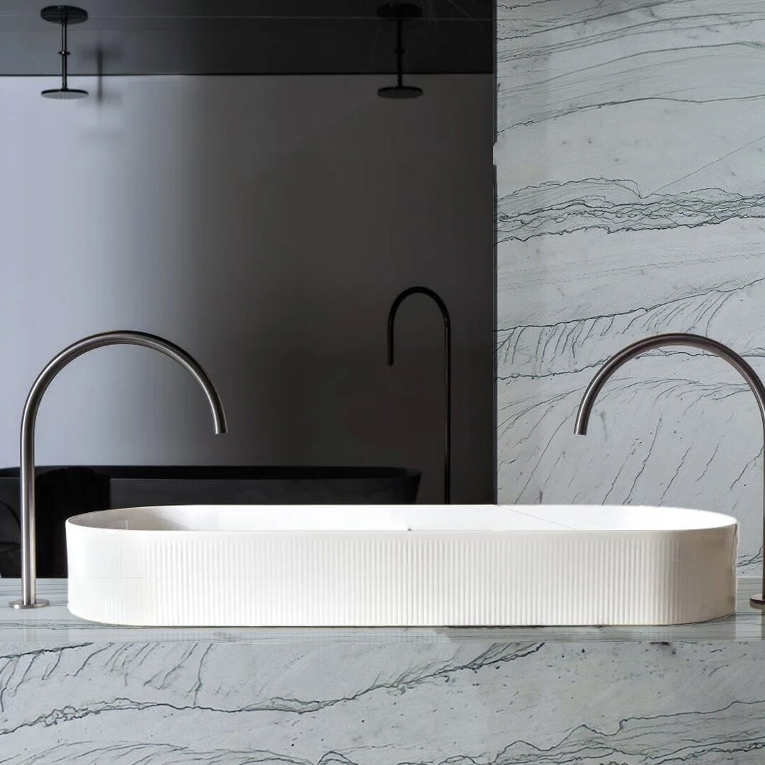 Luxury master bathroom featuring a white stone vanity top and sophisticated gray veining.
