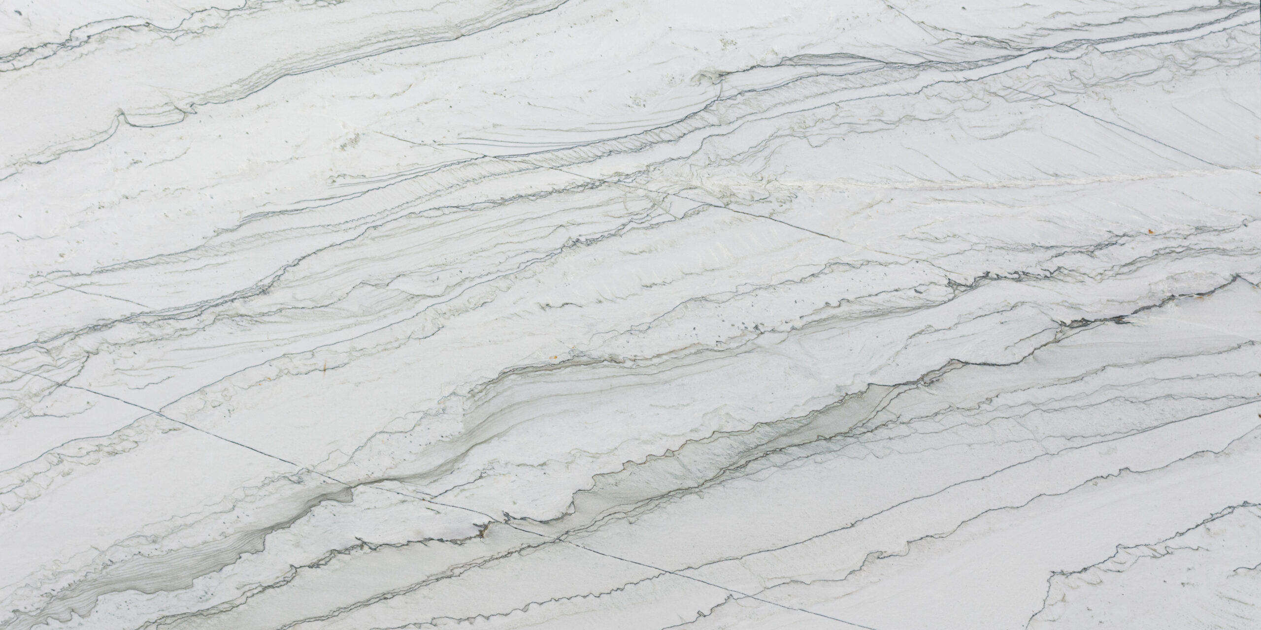 Full slab of premium natural stone featuring a creamy gray background and fluid charcoal patterns.