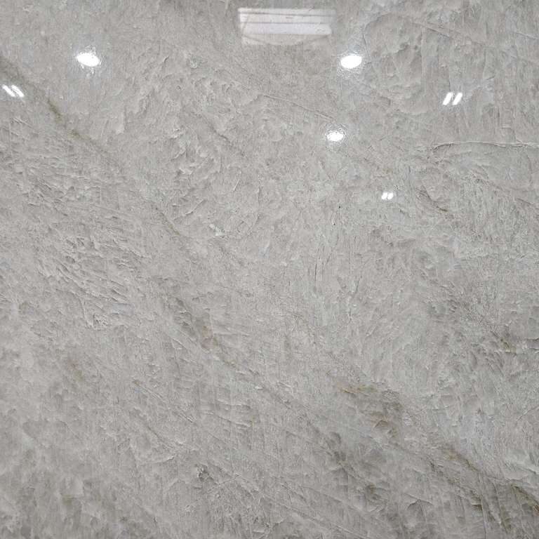 Macro shot focusing on the soft diagonal veins and mineral depth of this premium natural stone.