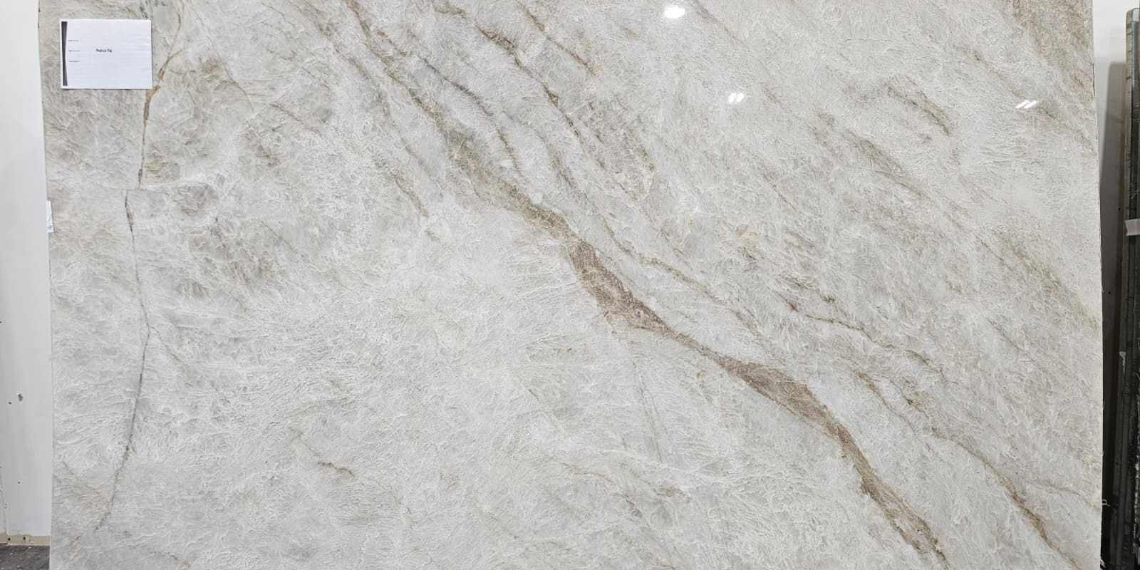 A large-format Brazilian quartzite slab displayed in a professional stone gallery setting.