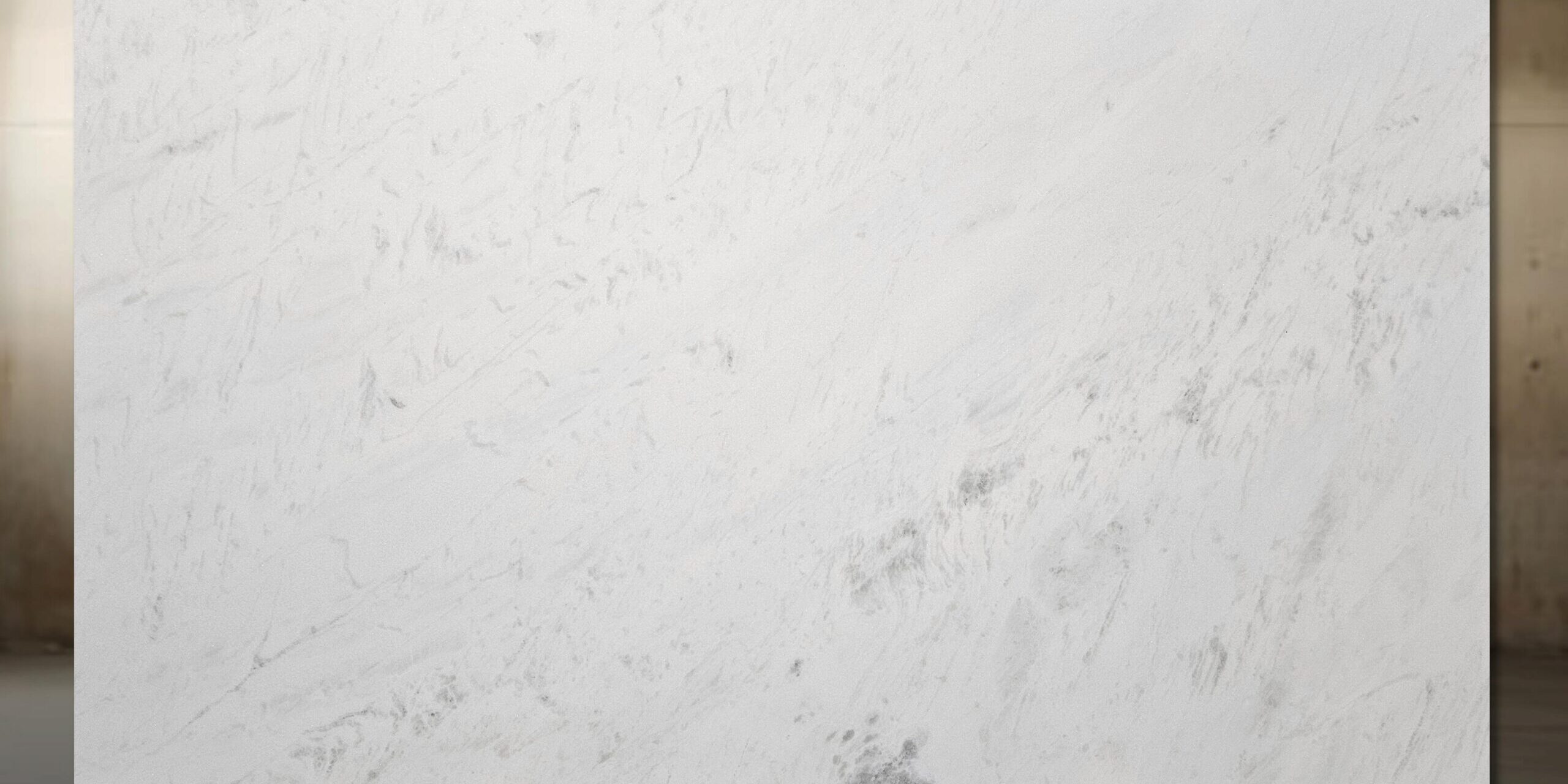A large-format premium White Marble slab displaying a clean background with fine blue-gray lines.