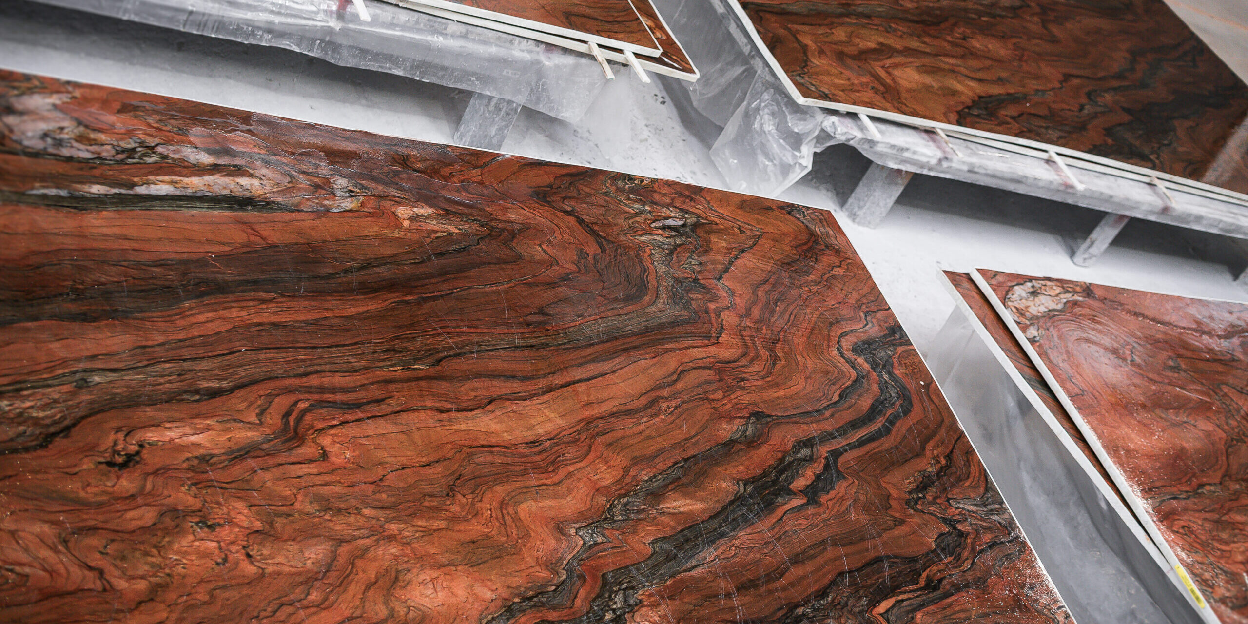 Large format slab with horizontal mineral movement for luxury fabrication.
