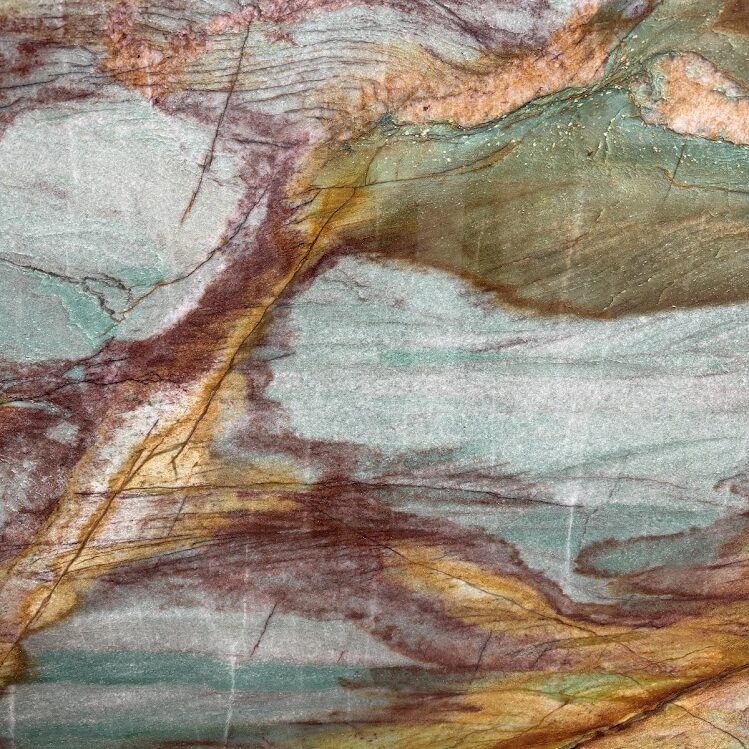 A detailed macro shot of the seafoam green crystalline structure and golden-bronze veins.
