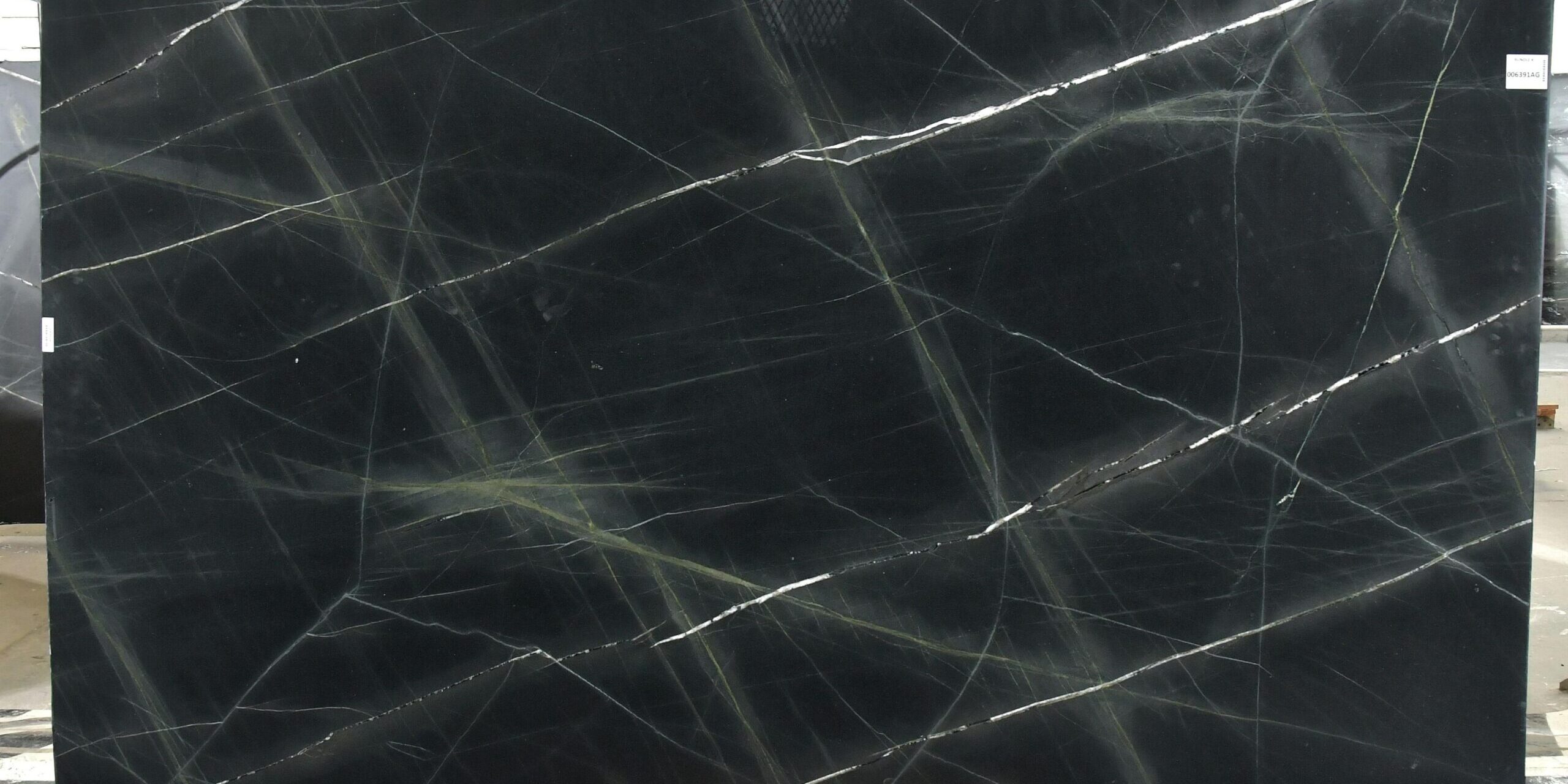 High-resolution image of a large-format black and green quartzite slab for architectural use.
