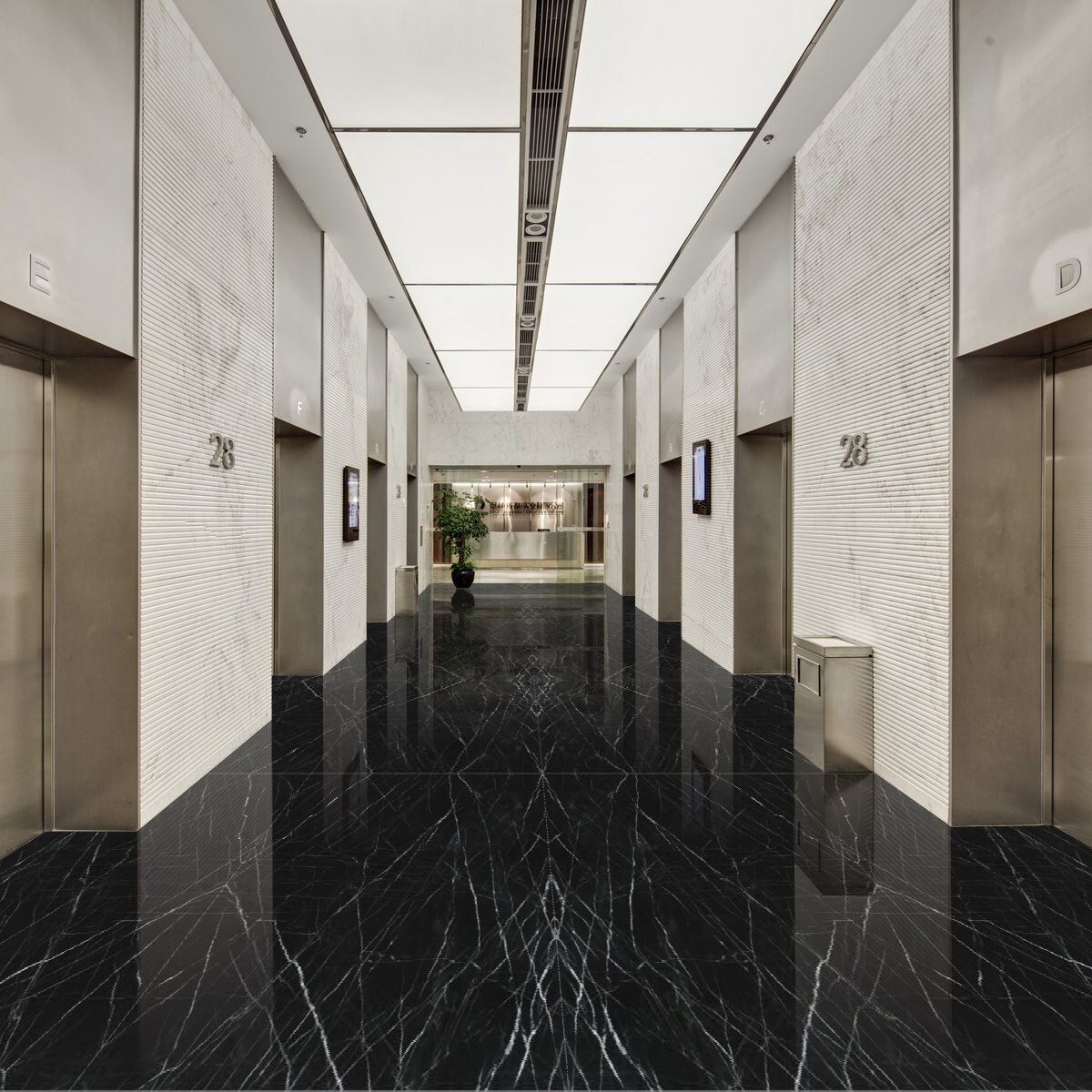 Grand foyer floor featuring large-format polished tiles in Venom Quartzite for a mirror-like finish.