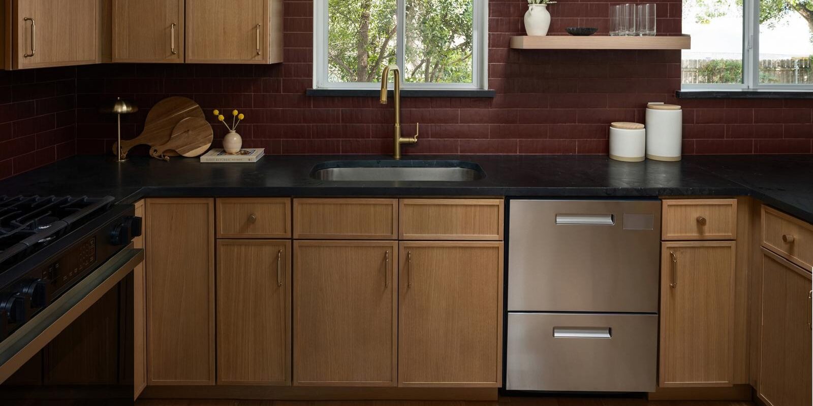 Spacious kitchen design with Black Diamond Quartzite countertops adding depth and luxury to the space.