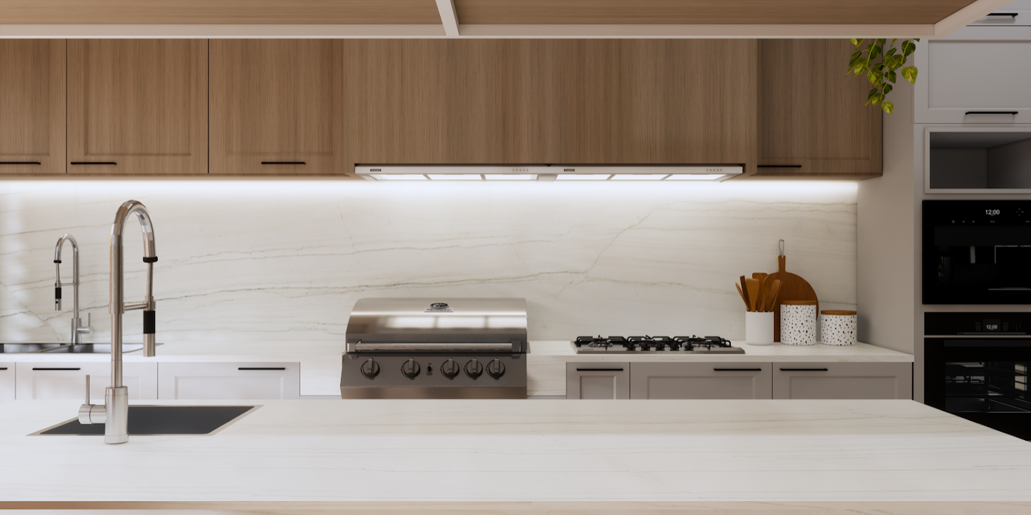 Luxurious kitchen island featuring White Lux countertops in a modern, open-concept home.