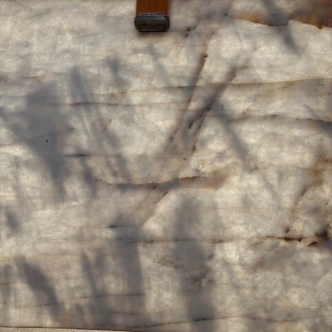 Macro shot of the shimmering white surface and translucent properties of natural stone.