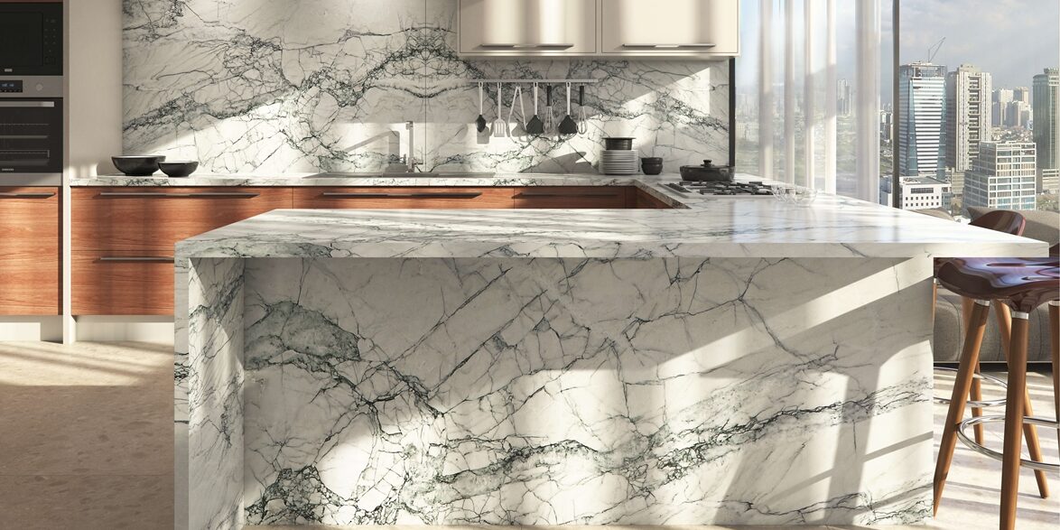 Stunning kitchen countertops and a large island made of Fantasy Lux Quartzite in a contemporary Austin home.