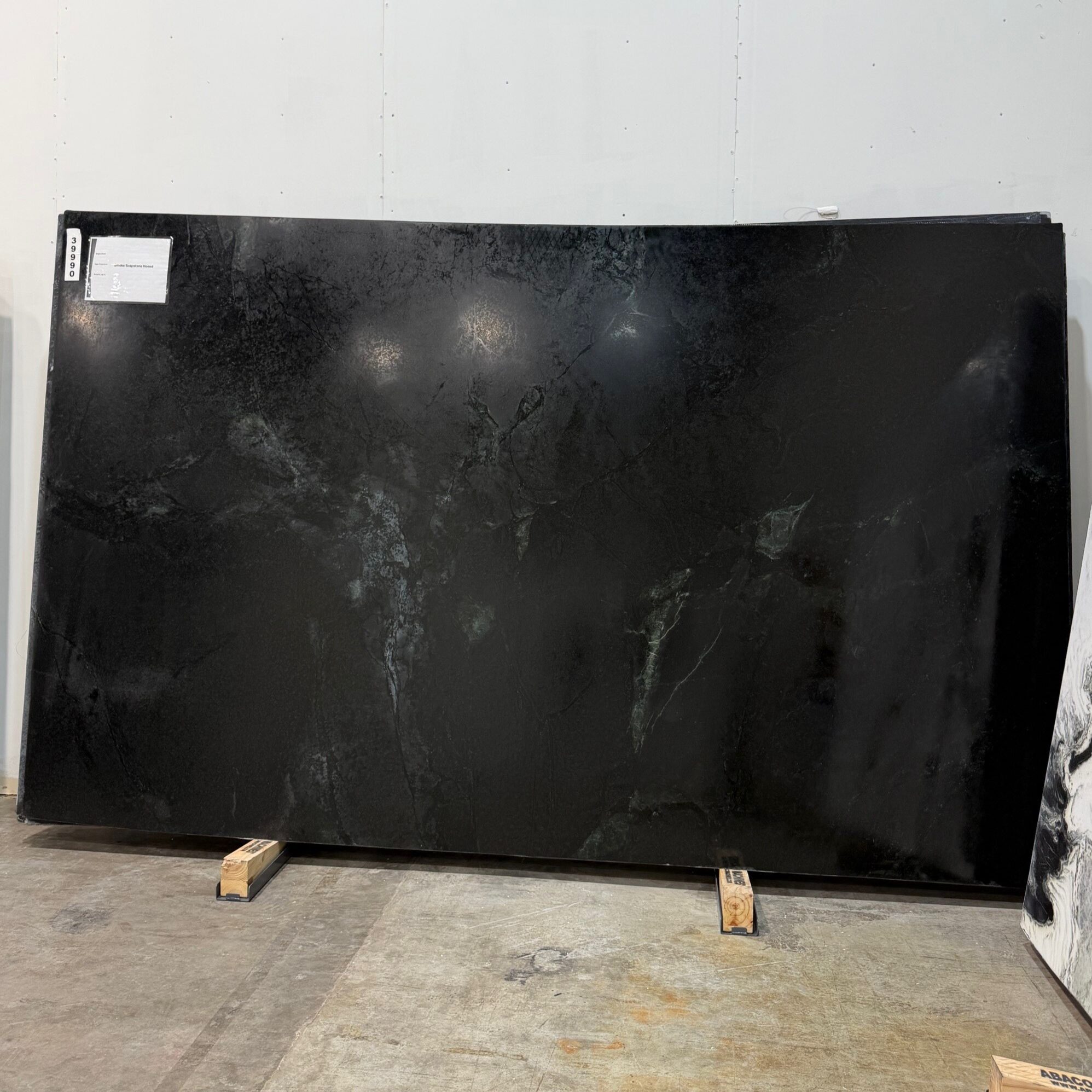 A stunning slab displayed in a modern stone boutique showroom in Austin, Texas.